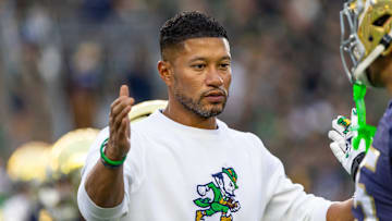 Sep 13, 2025; South Bend, Indiana, USA; Notre Dame Fighting Irish head coach Marcus Freeman greets players before a game against the Texas A&M Aggies at Notre Dame Stadium. Mandatory Credit: Michael Caterina-Imagn Images