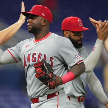 Apr 3, 2024; Miami, Florida, USA; Los Angeles Angels first baseman Miguel Sano (22) celebrates a victory against the Miami Marlins at loanDepot Park. Mandatory Credit: Jim Rassol-USA TODAY Sports