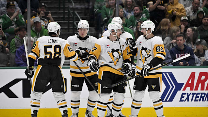 Apr 5, 2025; Dallas, Texas, USA; Pittsburgh Penguins defenseman Kris Letang (58) and 
ight wing Rutger McGroarty (2) and center Evgeni Malkin (71) and defenseman Erik Karlsson (65) celebrate after Penguins center Sidney Crosby (87) scores a power play goal against the Dallas Stars during the first period at the American Airlines Center. Mandatory Credit: Jerome Miron-Imagn Images