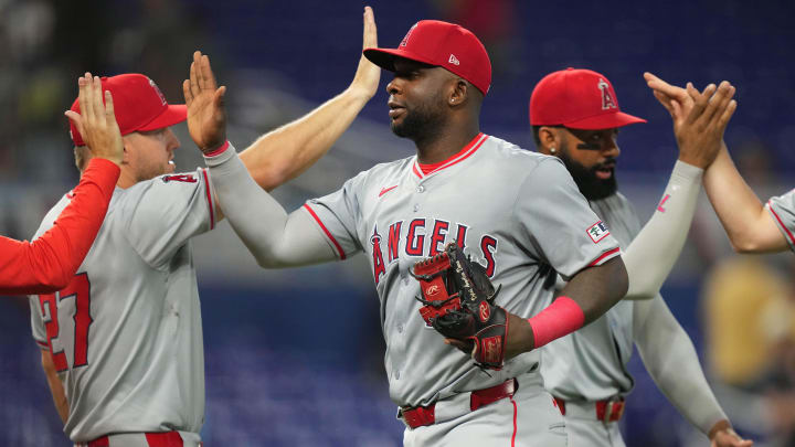 Apr 3, 2024; Miami, Florida, USA; Los Angeles Angels first baseman Miguel Sano (22) celebrates a victory against the Miami Marlins at loanDepot Park. Mandatory Credit: Jim Rassol-USA TODAY Sports