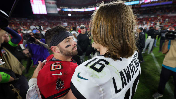 Dec 24, 2023; Tampa, Florida, USA;  Tampa Bay Buccaneers quarterback Baker Mayfield (6) greats Jacksonville Jaguars quarterback Trevor Lawrence (16) after a game at Raymond James Stadium. Mandatory Credit: Nathan Ray Seebeck-USA TODAY Sports