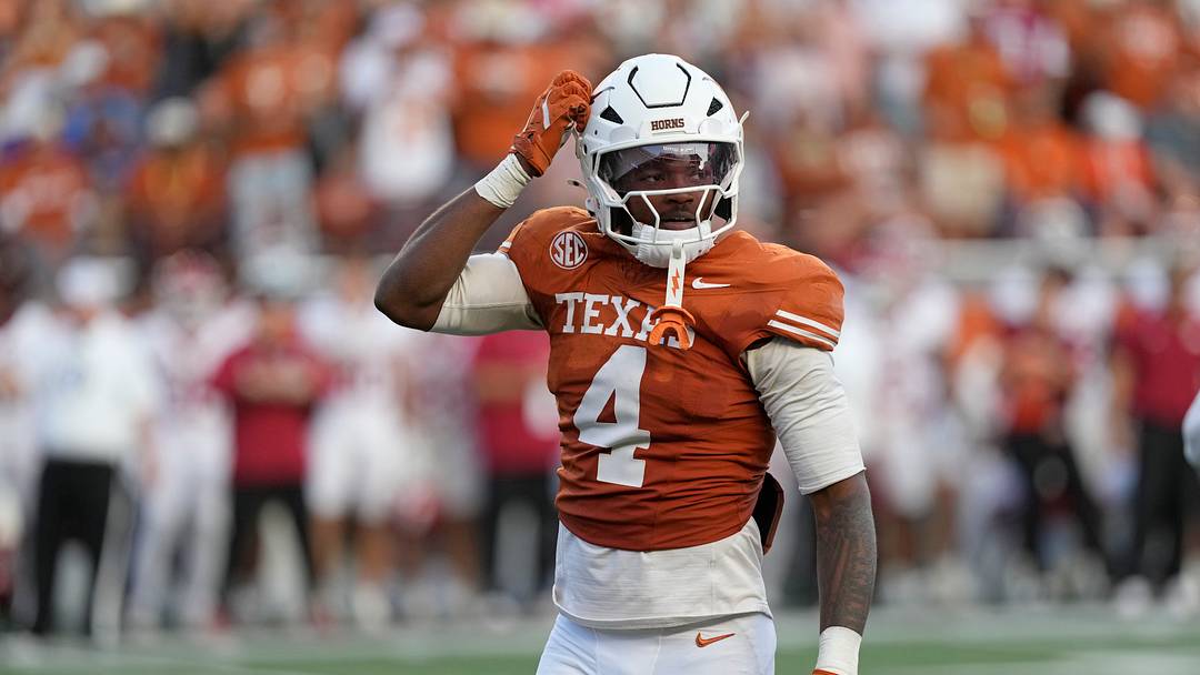 Nov 22, 2025; Austin, Texas, USA; Texas Longhorns defensive back Jelani McDonald (4) scratches his helmet after making a tackle during the second half against the Arkansas Razorbacks at Darrell K Royal-Texas Memorial Stadium. Mandatory Credit: Scott Wachter-Imagn Images