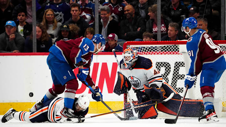 Mar 21, 2022; Denver, Colorado, USA; Colorado Avalanche right wing Valeri Nichushkin (13) and center Nazem Kadri (91) attempt to score past Edmonton Oilers defenseman Kris Russell (6) and goaltender Mike Smith (41) in the third  period at Ball Arena. Mandatory Credit: Ron Chenoy-Imagn Images