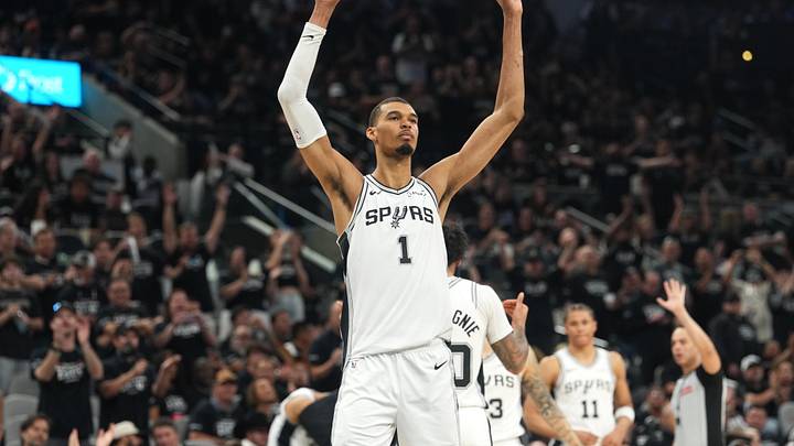 Apr 28, 2026; San Antonio, Texas, USA; San Antonio Spurs forward Victor Wembanyama (1) raises his arms and acknowledges the fans before leaving during the second half of game five of the first round of the 2026 NBA Playoffs against the Portland Trail Blazers at Frost Bank Center. Mandatory Credit: Scott Wachter-Imagn Images