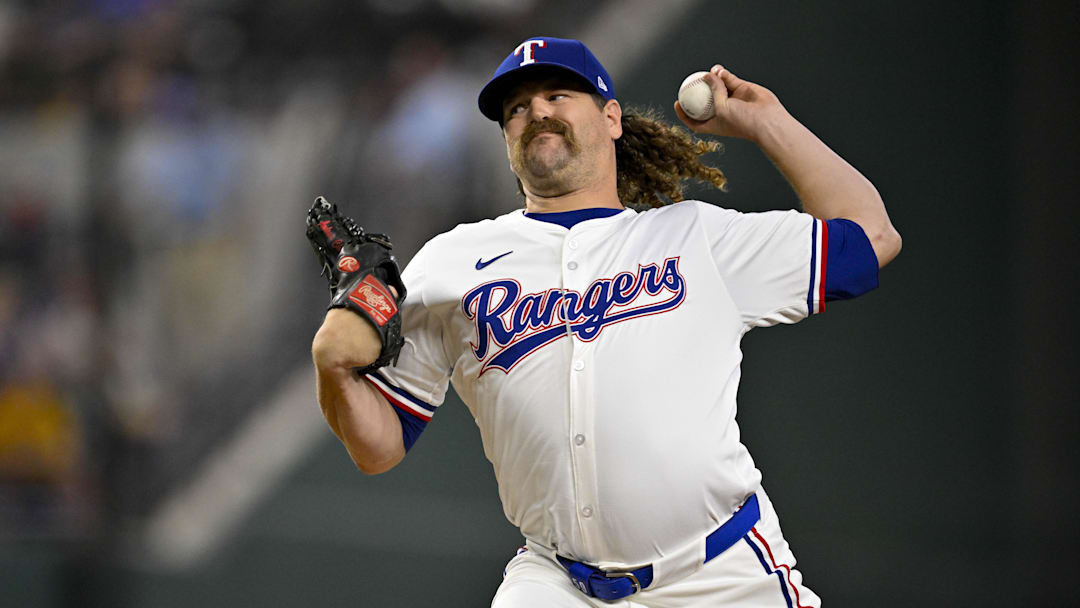 Aug 21, 2024; Arlington, Texas, USA; Texas Rangers relief pitcher Andrew Chafin (59) pitches against the Pittsburgh Pirates during the seventh inning at Globe Life Field.