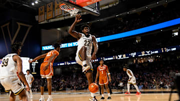 Feb 8, 2025; Nashville, Tennessee, USA; Vanderbilt Commodores forward Jaylen Carey (22) celebrates the big slam against the Texas Longhorns during the first half at Memorial Gymnasium. Mandatory Credit: Steve Roberts-Imagn Images