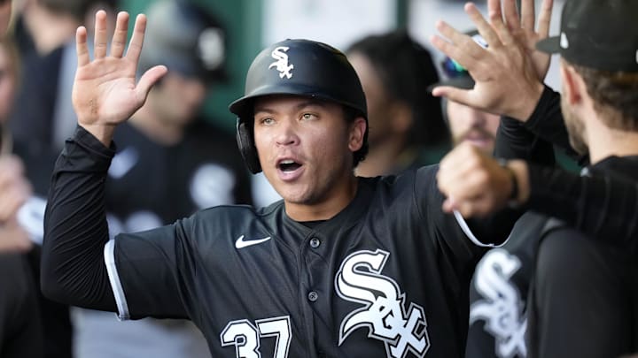 Apr 12, 2026; Kansas City, Missouri, USA; Chicago White Sox left fielder Dustin Harris (37) is congratulated by teammates after scoring a run during the seventh inning against the Kansas City Royals at Kauffman Stadium. Mandatory Credit: Jay Biggerstaff-Imagn Images