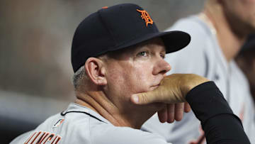 Apr 28, 2025; Houston, Texas, USA; Detroit Tigers manager A.J. Hinch (14) looks on from the dugout during the second inning against the Houston Astros at Daikin Park. Mandatory Credit: Troy Taormina-Imagn Images