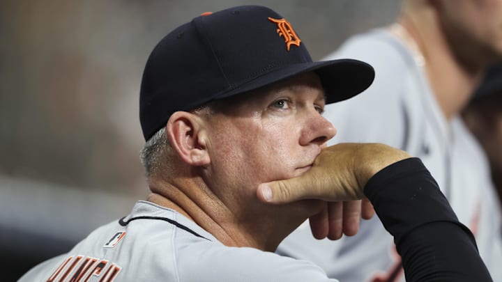 Apr 28, 2025; Houston, Texas, USA; Detroit Tigers manager A.J. Hinch (14) looks on from the dugout during the second inning against the Houston Astros at Daikin Park. Mandatory Credit: Troy Taormina-Imagn Images