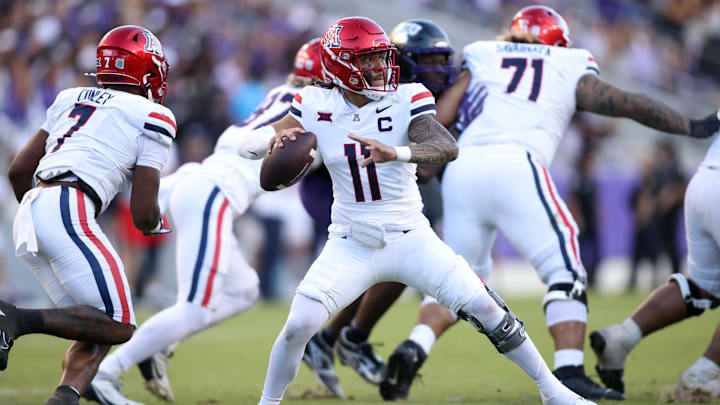 Nov 23, 2024; Fort Worth, Texas, USA;  Arizona Wildcats quarterback Noah Fifita (11) throws a pass against the TCU Horned Frogs in the second half at Amon G. Carter Stadium. Mandatory Credit: Tim Heitman-Imagn Images