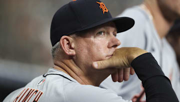 Detroit Tigers manager A.J. Hinch (14) looks on from the dugout during the second inning against the Houston Astros at Daikin Park.