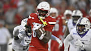Sep 5, 2025; Louisville, Kentucky, USA;  Louisville Cardinals tight end Jaleel Skinner (88) runs the ball against James Madison Dukes linebacker Trent Hendrick (5) during the first half at L&N Federal Credit Union Stadium. Mandatory Credit: Jamie Rhodes-Imagn Images