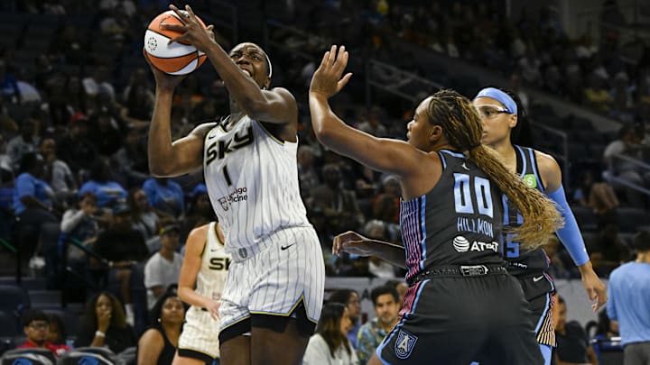Jul 16, 2025; Chicago, Illinois, USA;  Chicago Sky center Elizabeth Williams (1) shoots the ball against against the Atlanta Dream forward Naz Hillmon (00) during the first half at Wintrust Arena. Mandatory Credit: Matt Marton-Imagn Images