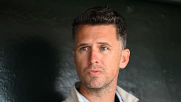 Jun 4, 2025; San Francisco, California, USA; Former San Francisco Giants player Buster Posey sits in the dugout before the game against the San Diego Padres at Oracle Park. Mandatory Credit: Eakin Howard-Imagn Images