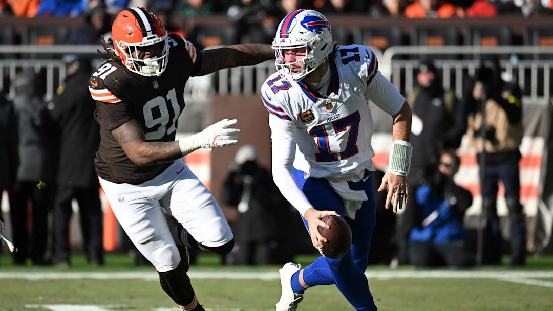 Buffalo Bills quarterback Josh Allen (17) is pressured by Cleveland Browns defensive end Alex Wright (91) during the first half at Huntington Bank Field.