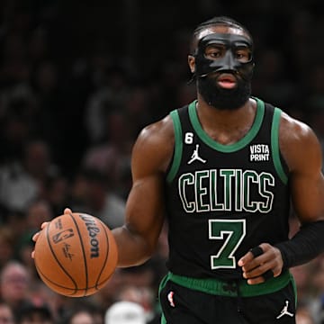 Mar 26, 2023; Boston, Massachusetts, USA; Boston Celtics guard Jaylen Brown (7) dribbles the ball against the San Antonio Spurs during the third quarter at the TD Garden. Mandatory Credit: Brian Fluharty-Imagn Images
