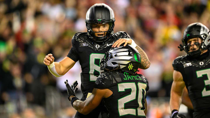 Oct 12, 2024; Eugene, Oregon, USA; Oregon Ducks quarterback Dillon Gabriel (8) celebrates a touchdown run during the second half against the Ohio State Buckeyes at Autzen Stadium. Mandatory Credit: Craig Strobeck-Imagn Images