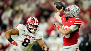 Indiana Hoosiers defensive lineman Stephen Daley (8) moves in on Ohio State Buckeyes quarterback Julian Sayin (10) on Saturday, Dec. 6, 2025, during the Big Ten football championship at Lucas Oil Stadium in Indianapolis.