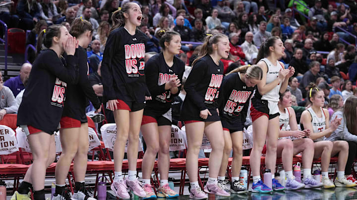 Muskego players cheer on their team during the WIAA Division 1 state semifinal girls basketball game against Arrowhead on March 14, 2025, at the Resch Center in Green Bay, Wis. Muskego players cheer on their team during the WIAA Division 1 state semifinal girls basketball game against Arrowhead on March 14, 2025, at the Resch Center in Green Bay, Wis.