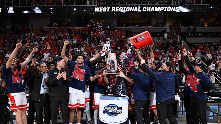 Mar 28, 2026; San Jose, CA, USA; The Arizona Wildcats celebrates with the West Regional Championship trophy after an Elite Eight game against the Purdue Boilermakers of the West Regional of the men's 2026 NCAA Tournament at SAP Center. Mandatory Credit: Eakin Howard-Imagn Images
