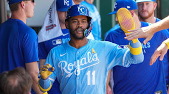 Sep 7, 2025; Kansas City, Missouri, USA; Kansas City Royals shortstop Maikel Garcia (11) celebrates in the dugout after scoring against the Minnesota Twins in the sixth inning at Kauffman Stadium. Mandatory Credit: Denny Medley-Imagn Images