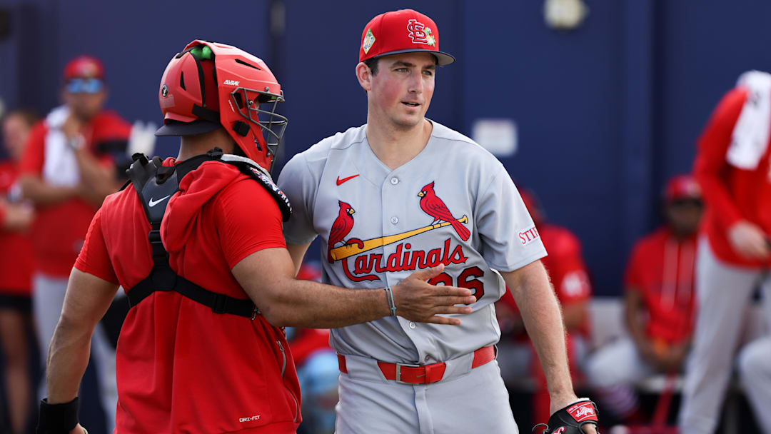 Feb 14, 2026; Jupiter, FL, USA; St. Louis Cardinals pitcher Michael McGreevy (36) and catcher Ivan Herrera (48) hug after a bullpen session during a spring training workout at Roger Dean Chevrolet Stadium. Mandatory Credit: Sam Navarro-Imagn Images