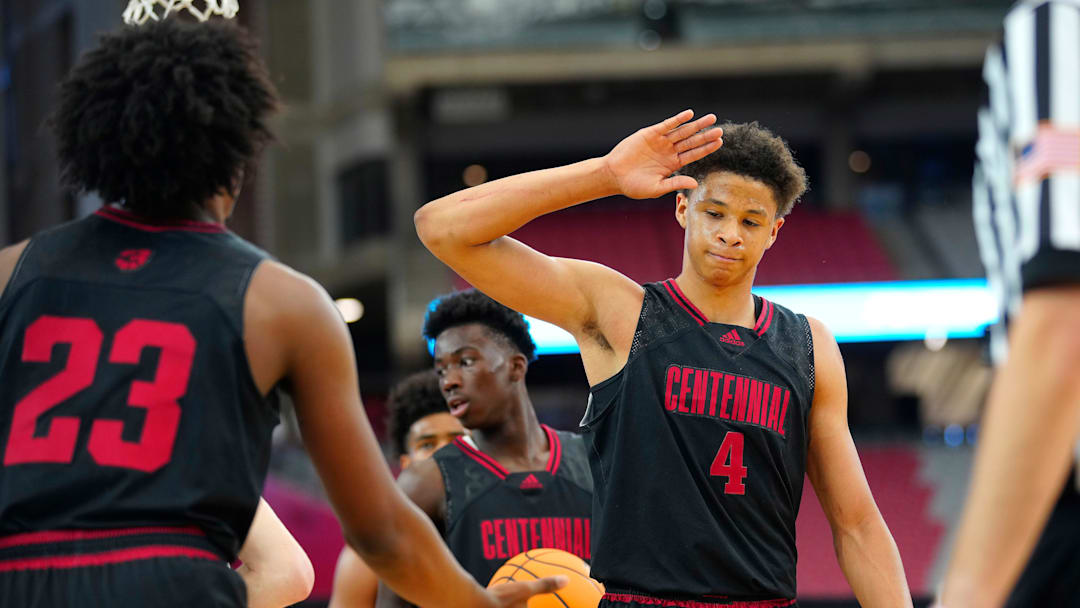 Corona Centennial wing Carter Bryant (4), a five-star commit to University of Arizona, high-fives teammates against Corner Canyon during the Section 7 Basketball Tournament at State Farm Stadium in Glendale on June 23, 2023.