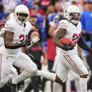 Sep 8, 2024; Orchard Park, New York, USA; Arizona Cardinals running back DeeJay Dallas (20) returns a kick off for a touchdown against the Buffalo Bills during the second half at Highmark Stadium. Mandatory Credit: Gregory Fisher-Imagn Images