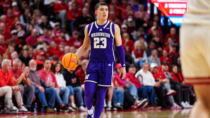 Jan 21, 2026; Lincoln, Nebraska, USA; Washington Huskies guard JJ Mandaquit (23) dribbles during the second half against the Nebraska Cornhuskers at Pinnacle Bank Arena. Mandatory Credit: Dylan Widger-Imagn Images