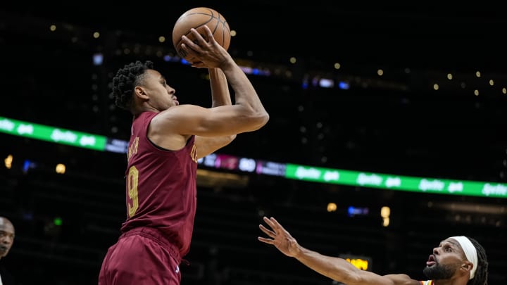 Oct 10, 2023; Atlanta, Georgia, USA; Cleveland Cavaliers guard Zhaire Smith (19) shoots over Atlanta Hawks guard Patty Mills (8) during the second half at State Farm Arena. Mandatory Credit: Dale Zanine-USA TODAY Sports