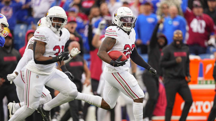 Sep 8, 2024; Orchard Park, New York, USA; Arizona Cardinals running back DeeJay Dallas (20) returns a kick off for a touchdown against the Buffalo Bills during the second half at Highmark Stadium. Mandatory Credit: Gregory Fisher-Imagn Images