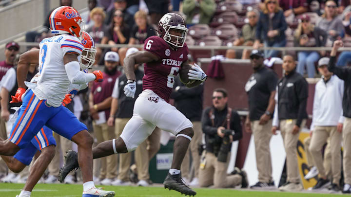 Texas A&M Aggies running back Devon Achane (6) runs the ball in the first half against the Florida Gators at Kyle Field. Texas A&M Aggies running back Devon Achane (6) runs the ball in the first half against the Florida Gators at Kyle Field.