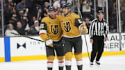 Oct 9, 2024; Las Vegas, Nevada, USA; Vegas Golden Knights right wing Victor Olofsson (95) celebrates with defenseman Shea Theodore (27) after scoring a goal against the Colorado Avalanche during the second period at T-Mobile Arena. Mandatory Credit: Lucas Peltier-Imagn Images