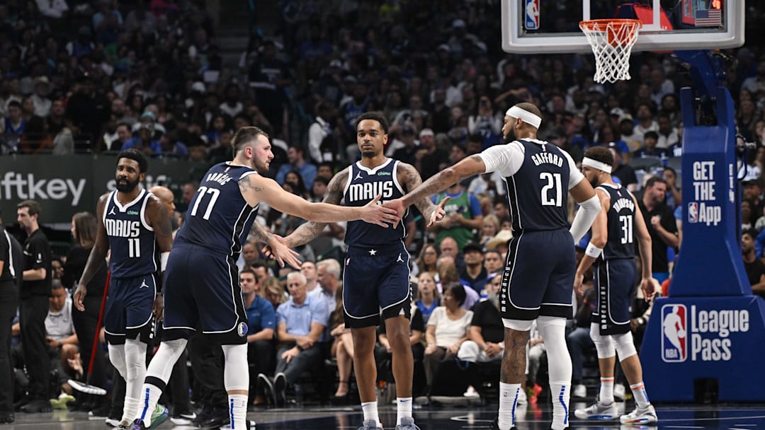 Oct 24, 2024; Dallas, Texas, USA; Dallas Mavericks guard Kyrie Irving (11) and guard Luka Doncic (77) and forward P.J. Washington (25) and center Daniel Gafford (21) and guard Klay Thompson (31) huddle up during the second half against the San Antonio Spurs at the American Airlines Center. Mandatory Credit: Jerome Miron-Imagn Images Oct 24, 2024; Dallas, Texas, USA; Dallas Mavericks guard Kyrie Irving (11) and guard Luka Doncic (77) and forward P.J. Washington (25) and center Daniel Gafford (21) and guard Klay Thompson (31) huddle up during the second half against the San Antonio Spurs at the American Airlines Center. Mandatory Credit: Jerome Miron-Imagn Images
