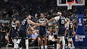 Oct 24, 2024; Dallas, Texas, USA; Dallas Mavericks guard Kyrie Irving (11) and guard Luka Doncic (77) and forward P.J. Washington (25) and center Daniel Gafford (21) and guard Klay Thompson (31) huddle up during the second half against the San Antonio Spurs at the American Airlines Center. Mandatory Credit: Jerome Miron-Imagn Images
