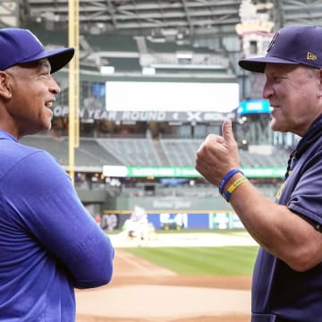 Aug 13, 2024; Milwaukee, Wisconsin, USA;  Los Angeles Dodgers manager Dave Roberts (30) talks with Milwaukee Brewers manager Pat Murphy (21) prior to the game at American Family Field. Mandatory Credit: Jeff Hanisch-USA TODAY Sports