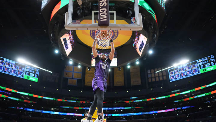 Nov 15, 2023; Los Angeles, California, USA; Sacramento Kings center JaVale McGee (00) dunks the ball against the Los Angeles Lakers in the second half at Crypto.com Arena. Mandatory Credit: Kirby Lee-USA TODAY Sports