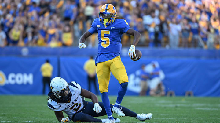 Pittsburgh Panthers wide receiver Raphael Williams Jr. (5) celebrates after a catch against West Virginia Mountaineers safety Aubrey Burks (2) during the second quarter of the Backyard Brawl.