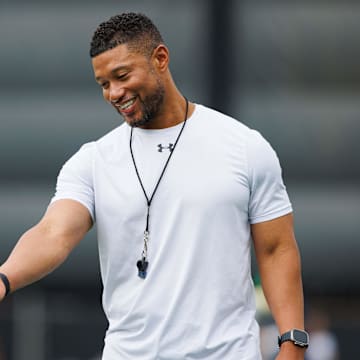 Notre Dame head coach Marcus Freeman greets players during a Notre Dame football practice at Irish Athletic Center on Tuesday, Aug. 6, 2024, in South Bend.