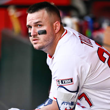 Aug 5, 2025; Anaheim, California, USA; Los Angeles Angels designated hitter Mike Trout (27) prepares to bat in the dugout during the first inning against the Tampa Bay Rays at Angel Stadium of Anaheim. Mandatory Credit: Kelvin Kuo-Imagn Images