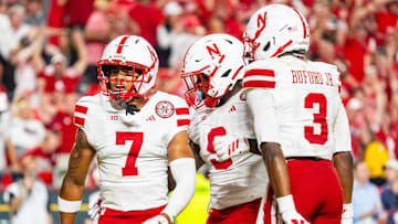 Nebraska Cornhuskers defensive back Malcolm Hartzog Jr. celebrates with linebacker Vincent Shavers Jr. and defensive back Marques Buford Jr.