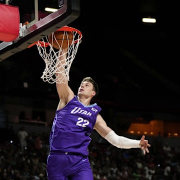 Jul 14, 2025; Las Vegas, NV, USA;  Utah Jazz forward Kyle Filipowski (22) dunks the ball against the San Antonio Spurs during the first half of a NBA basketball game at the Thomas & Mack Center. Mandatory Credit: Lucas Peltier-Imagn Images