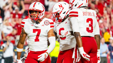 Nebraska Cornhuskers defensive back Malcolm Hartzog Jr. celebrates with linebacker Vincent Shavers Jr. and defensive back Marques Buford Jr.