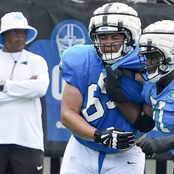 Jul 30, 2024; Charlotte, NC, USA; Carolina Panthers guard Damien Lewis (68) and offensive tackle Ricky Lee (61) drill during training camp at Carolina Panthers Practice Fields.