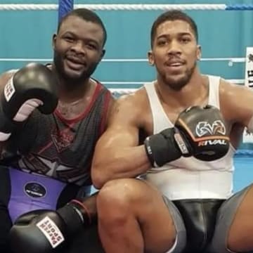 Reflecting the legendary 1974 "Rumble in the Jungle," Martin Bakole [left] calls out Anthony Joshua [right] for a high-stakes fight in Africa