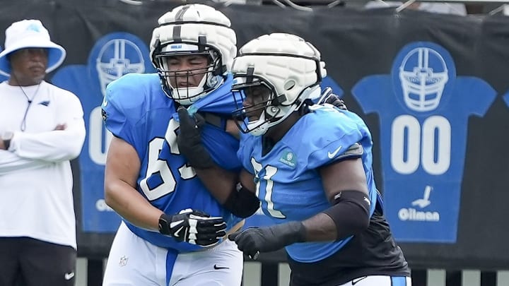 Jul 30, 2024; Charlotte, NC, USA; Carolina Panthers guard Damien Lewis (68) and offensive tackle Ricky Lee (61) drill during training camp at Carolina Panthers Practice Fields.