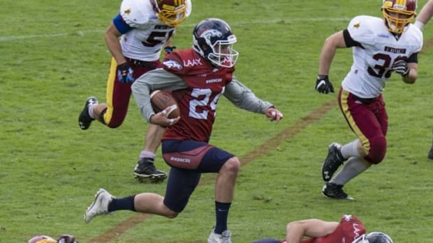 Alex Reich hurdles his own teammate after an interception return for the Calanda Broncos. 