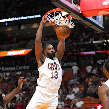 Mar 24, 2024; Miami, Florida, USA;  Cleveland Cavaliers center Tristan Thompson (13) gets a dunk against the Miami Heat during the second half at Kaseya Center. Mandatory Credit: Jim Rassol-Imagn Images