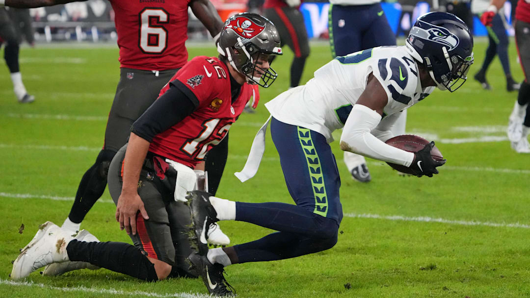 Nov 13, 2022; Munich, Germany; Tampa Bay Buccaneers cornerback Zyon McCollum (27) intercepts a pass intended for Tampa Bay Buccaneers quarterback Tom Brady (12) in the second half tduring an NFL International Series game at Allianz Arena. Mandatory Credit: Kirby Lee-Imagn Images