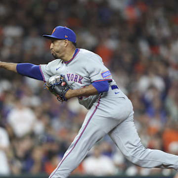 Mar 28, 2025; Houston, TX, USA; New York Mets relief pitcher Edwin Diaz (39) delivers a pitch during the ninth inning against the Houston Astros at Daikin Park. Mandatory Credit: Troy Taormina-Imagn Images